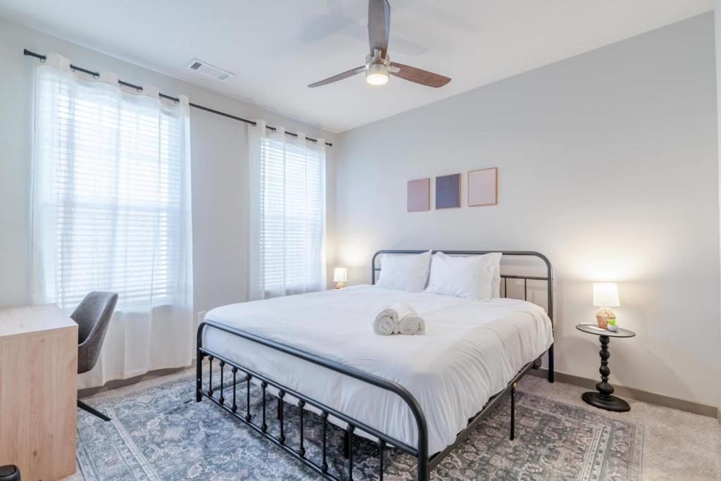 a bedroom with a bed and a ceiling fan at Super Central 1BD Workers Paradise in Charlotte