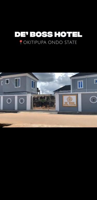 a picture of a blue house with a hotel at DE'BOSS hotels and suites in Okitipupa