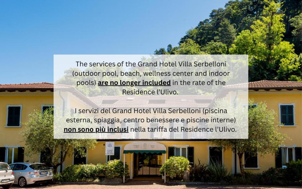 a sign in front of a building at Residence L'Ulivo - Apartments in the city Center, with Fitness, Squash & Private Parking in Bellagio
