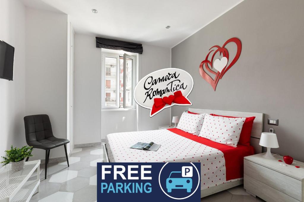 a bedroom with a bed with a free parking sign at Gaeta, B&B la Loggia in Gaeta
