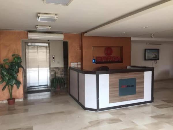 a lobby with a reception desk in a building at Astana in Sowayma