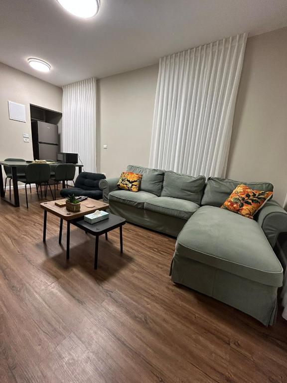 a living room with a couch and a table at Quiet Corner in Mafshatah