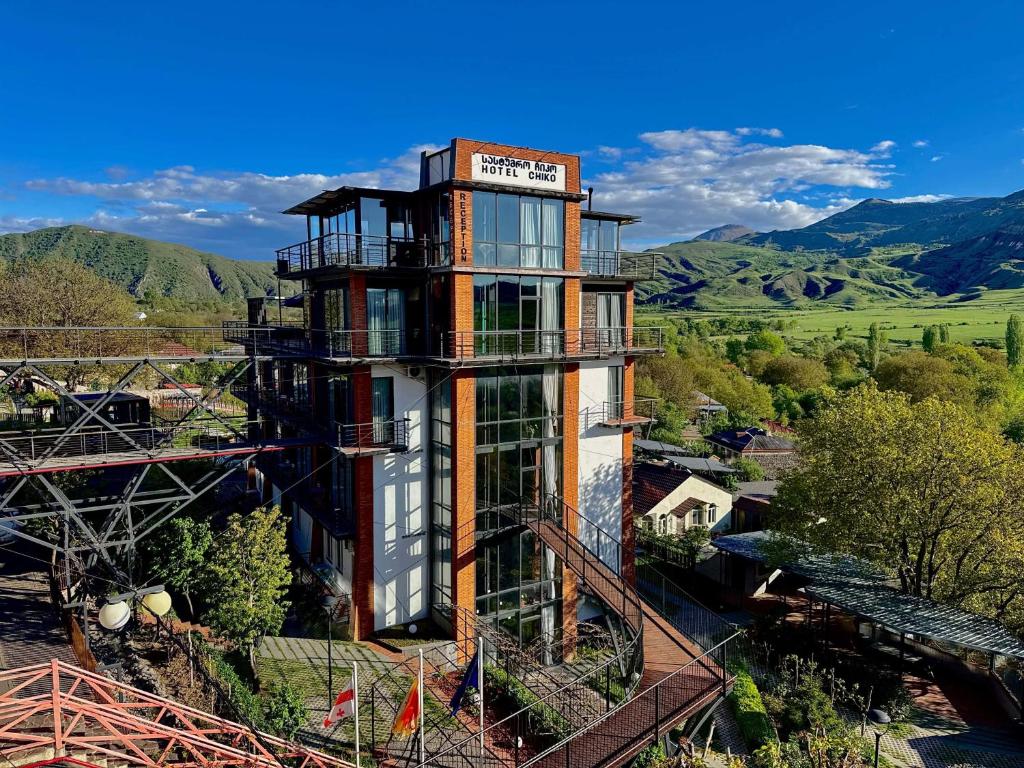 a building with a balcony on the side of it at Chiko Group in Aspindza