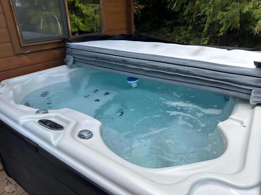a bath tub with at Sq Bayside Cedars in Sequim