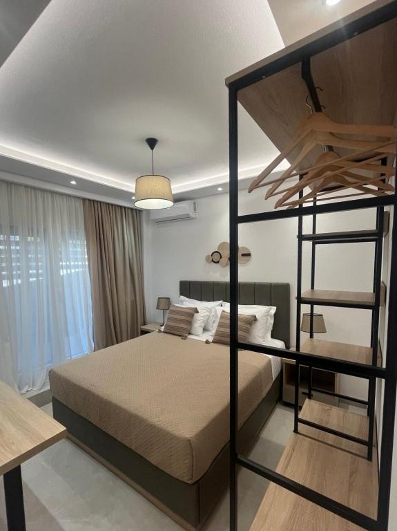 a bedroom with a bunk bed with a ladder at Malama's apartment in Neos Marmaras