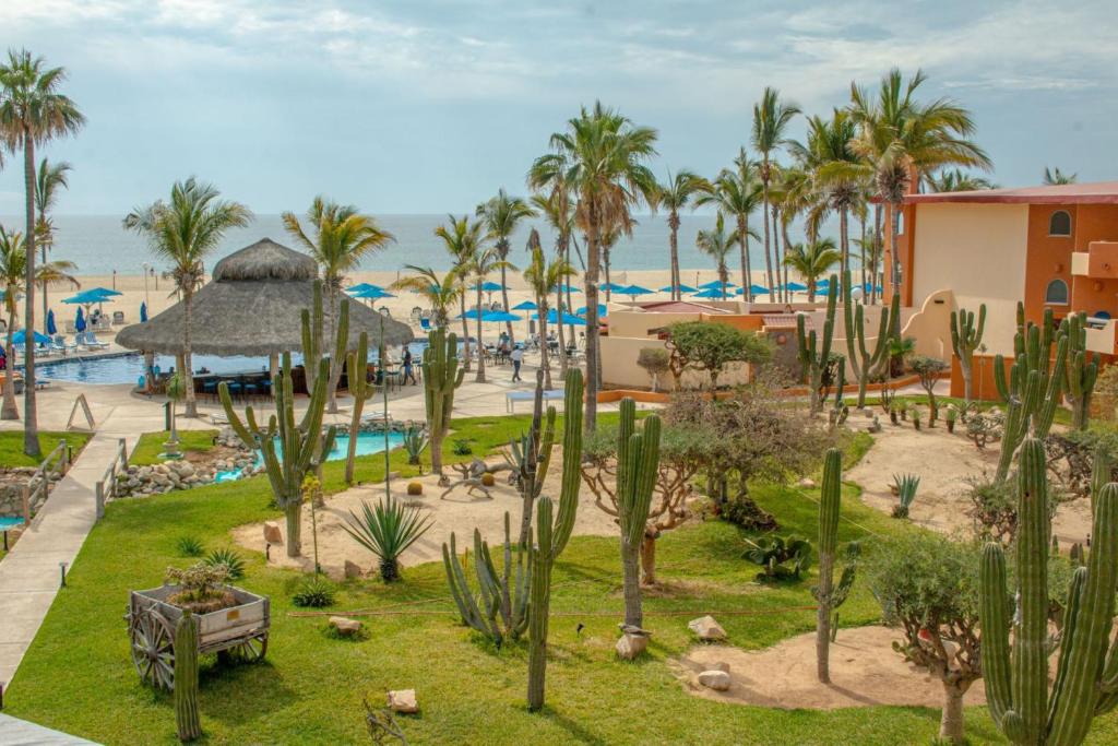a view of a resort with palm trees and a pool at Posada Real Los Cabos in San José del Cabo