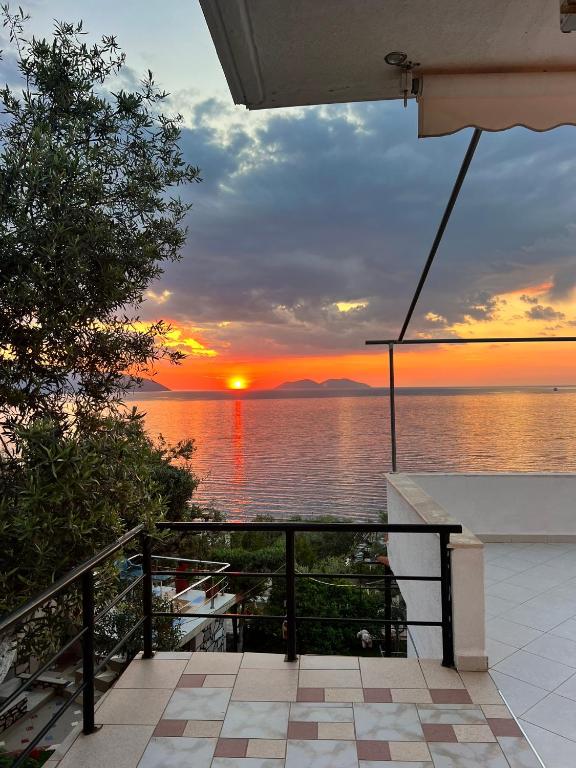 a sunset from the balcony of a house at Vila Endry in Vlorë