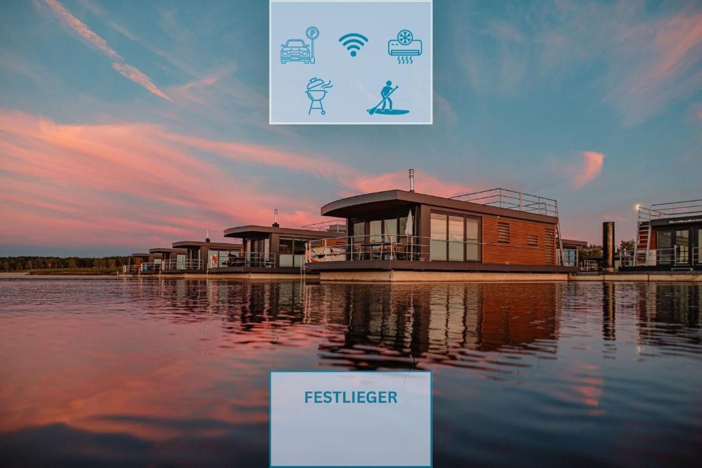 a poster for a festival with a house on the water at Floatinghouse Seestern in Klitten