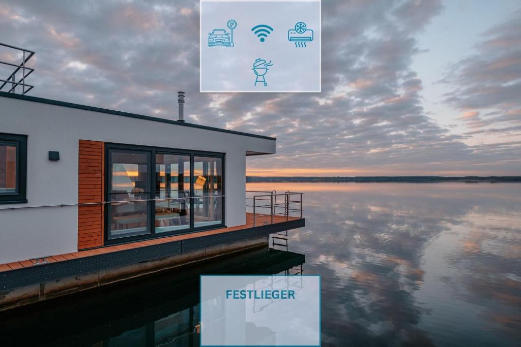 a building next to a body of water at Floatinghouse Milan - LP9 in Vetschau