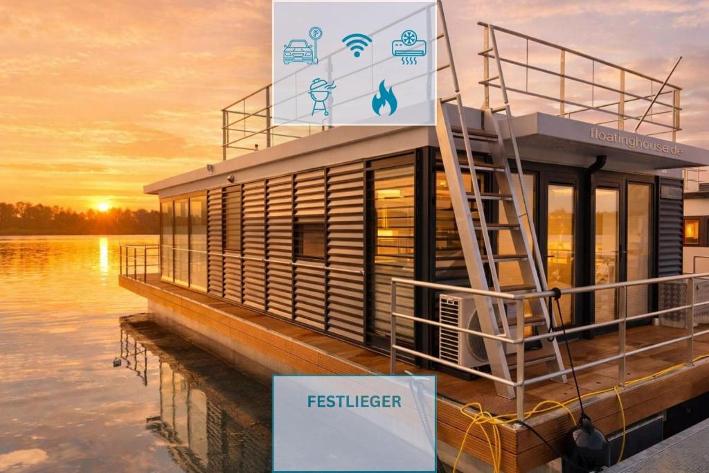 a sign on a boat in the water at Floatinghouse Bakerman in Zehdenick