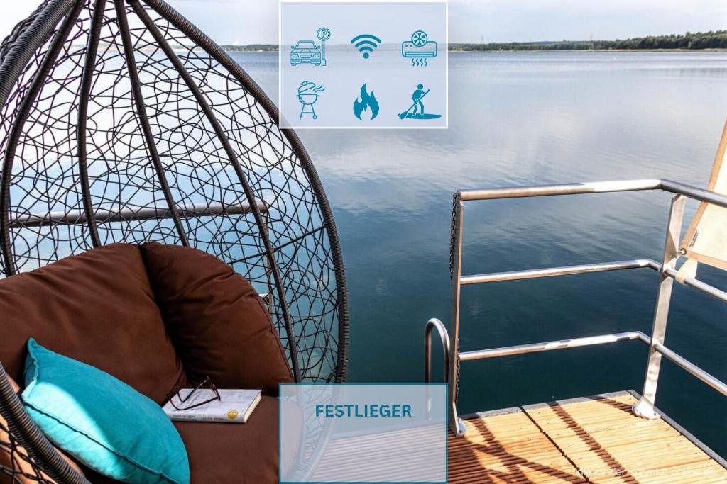 a sign on the back of a boat on a body of water at Floatinghouse KonTiki - LP8 in Vetschau
