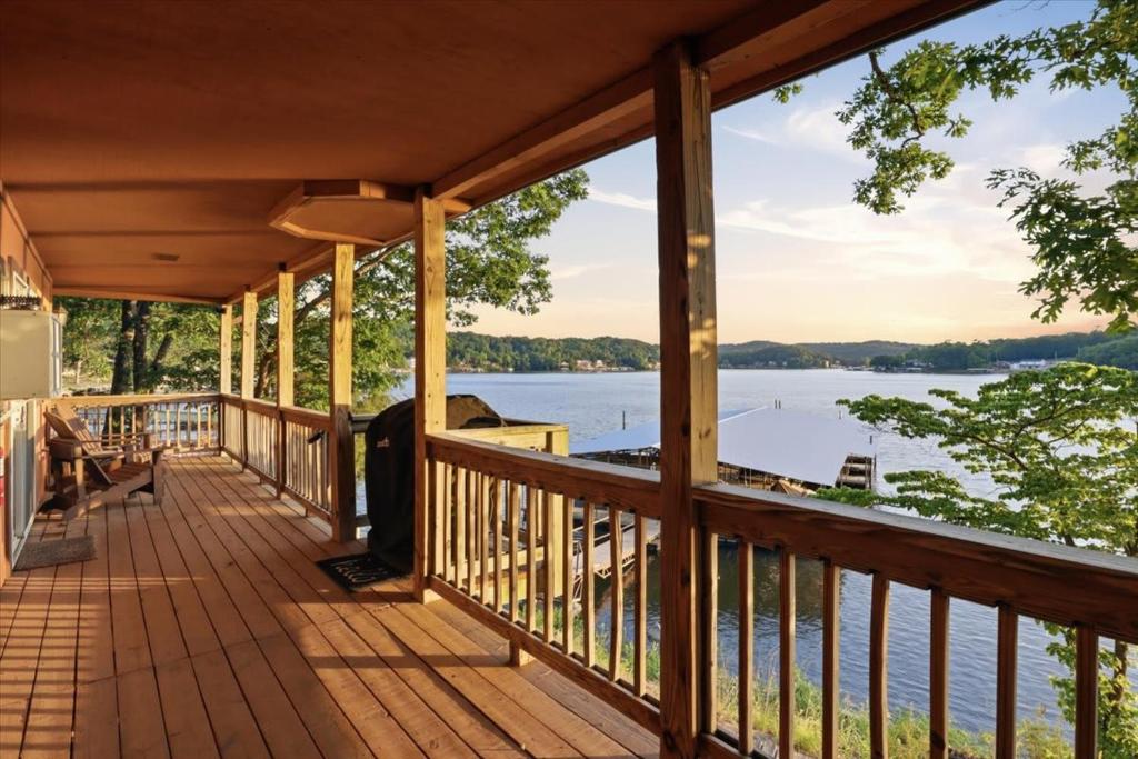 a porch of a house with a view of the water at Emerald waters in Camdenton
