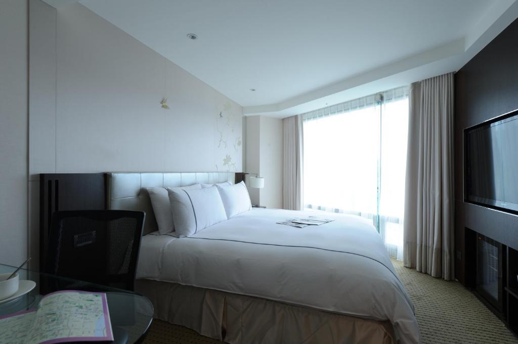 Postel nebo postele na pokoji v ubytování K Hotel Taipei Dunnan