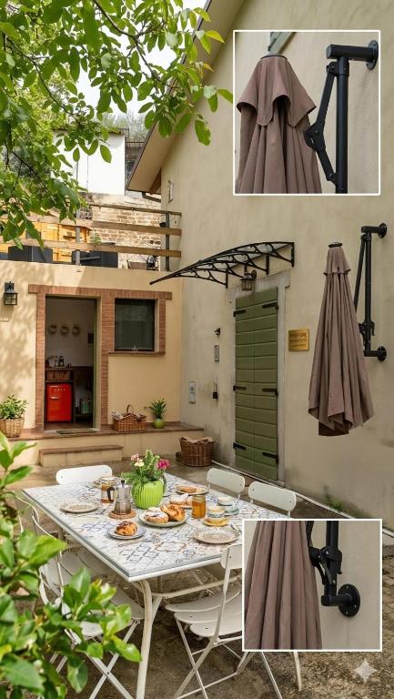 a patio with a table and chairs and a kitchen at Casa sul fiume con giardino e terrazza in Pianello