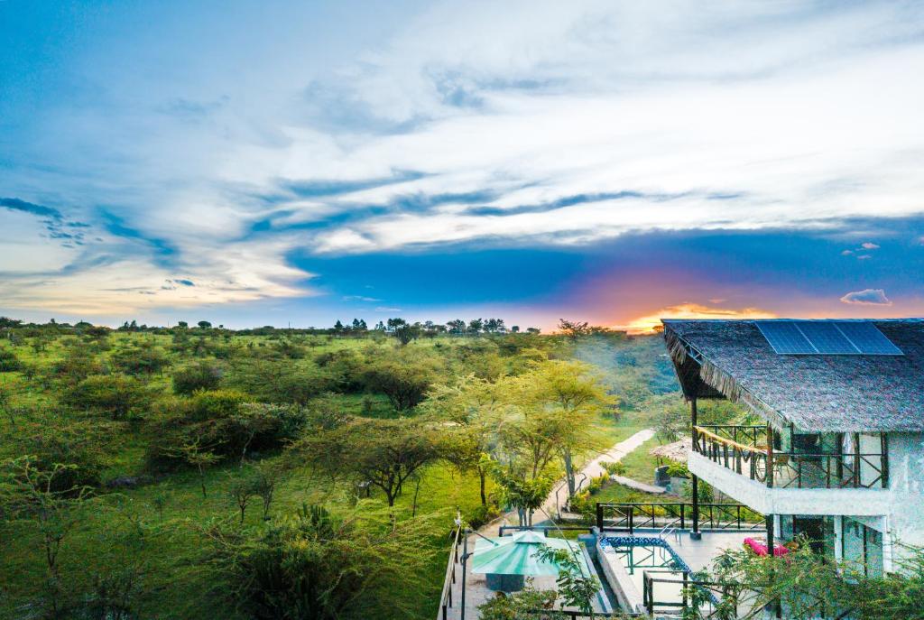 an aerial view of a house with solar panels on it at Kitumo Mara Lodges in Mara Simba