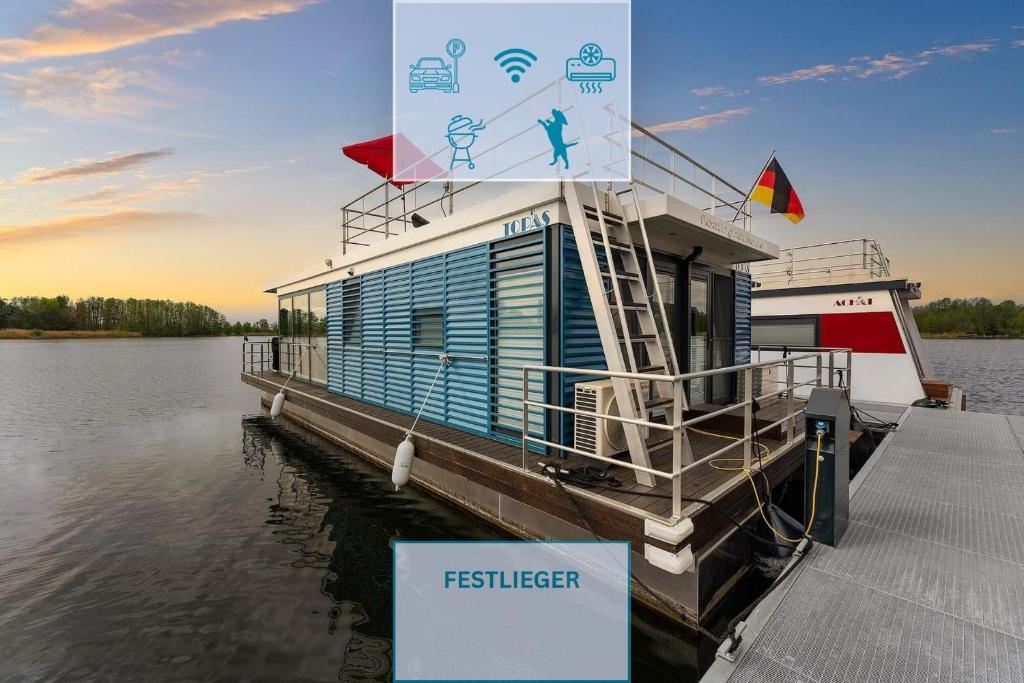 a ferry boat is docked at a dock at Floatinghouse Topas in Zehdenick