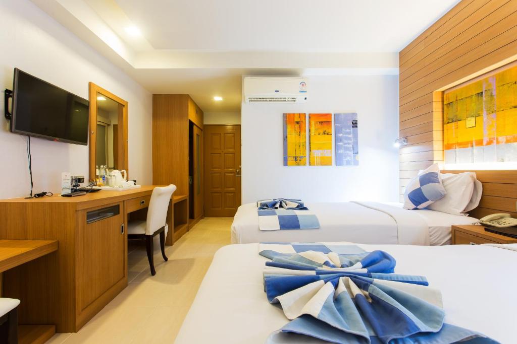 Postel nebo postele na pokoji v ubytování Chaweng Budget Hotel