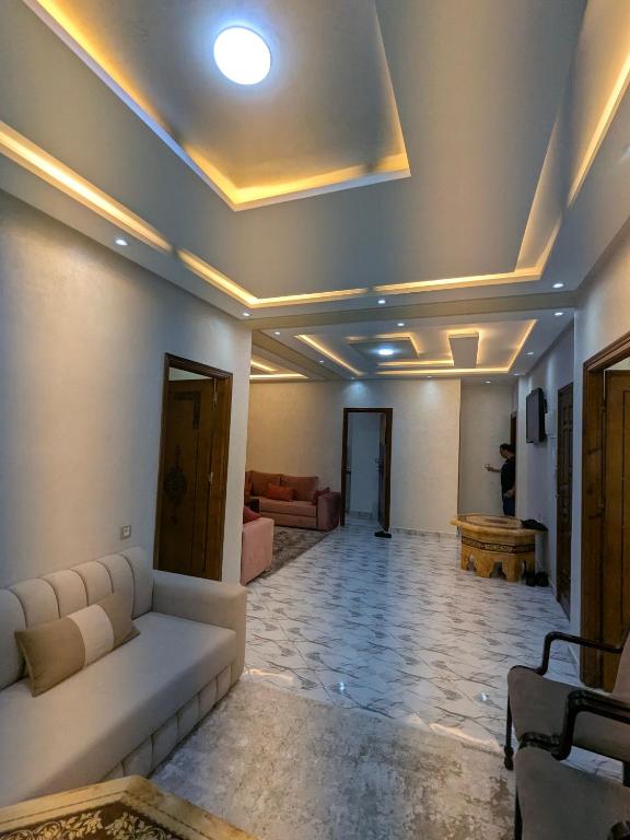 a living room with a white couch and a ceiling at House apartment in Tangier