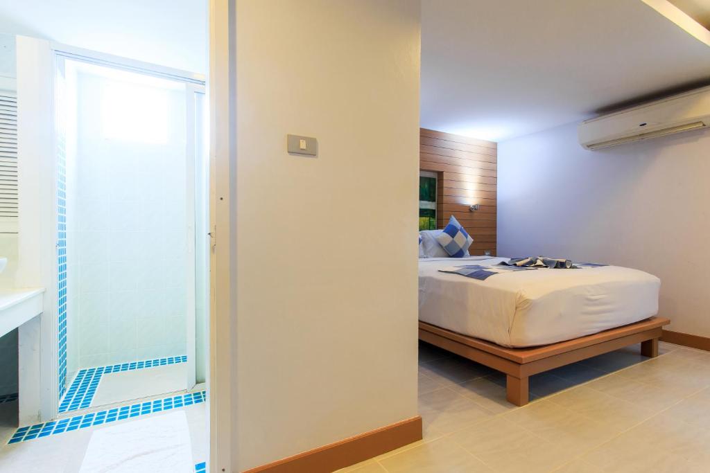 Postel nebo postele na pokoji v ubytování Chaweng Budget Hotel