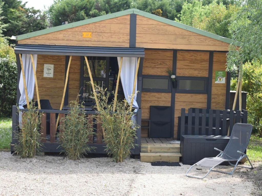 a gazebo with two chairs and a table at Chalet clim, TV - 2 pers. - API-1-52-2795 in Noves