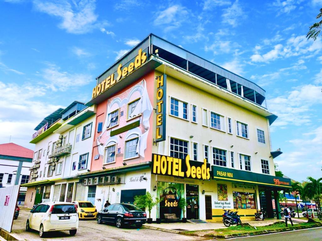 a hotel with cars parked in front of it at Seeds Hotel Shah Alam Section 19 in Shah Alam