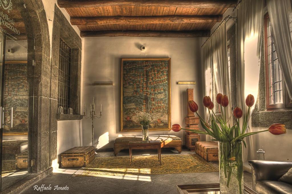 a living room with a couch and a table at Castello di Casapozzano in Aversa