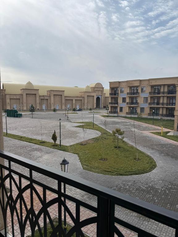 a view of a building from a balcony at Yassi Apartment in Türkistan