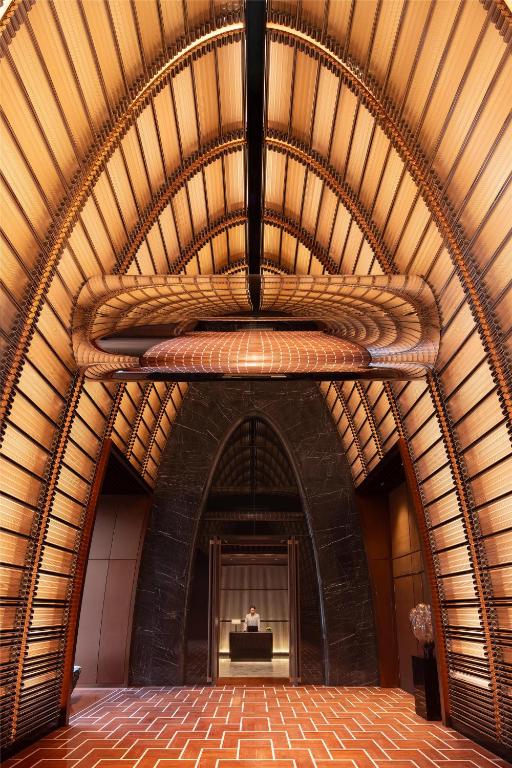 a large room with a large wooden ceiling at Grand Hyatt Kunming in Kunming