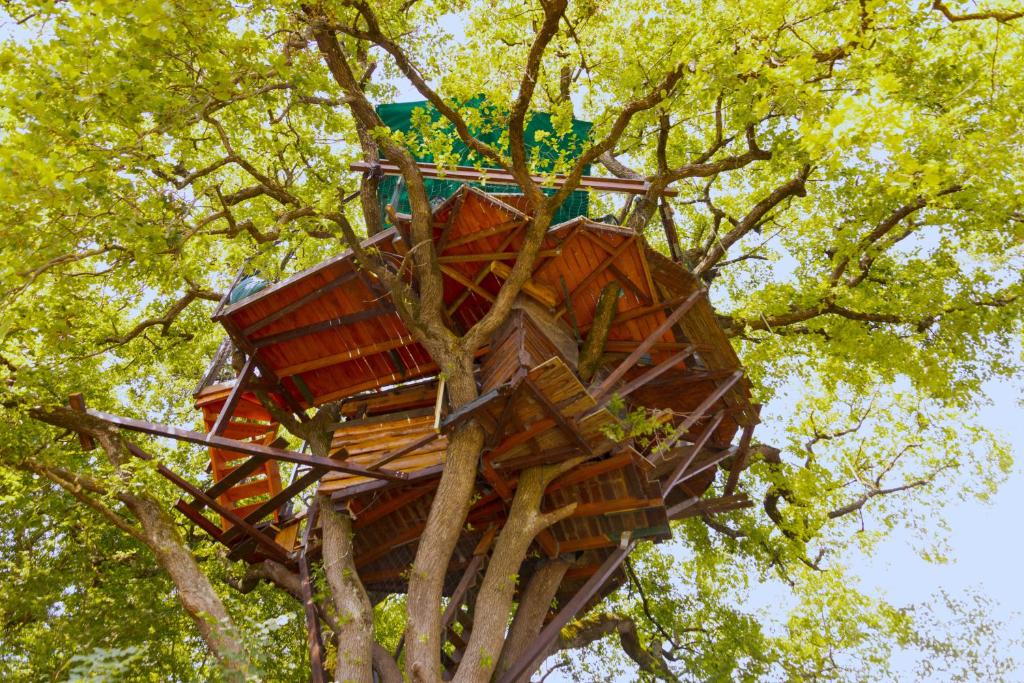 a tree house in the middle of a tree at B&B La Cabane Insolite in Monès