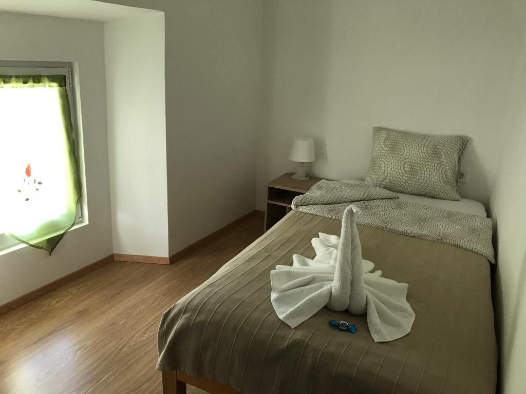 Rúm í herbergi á B&B Rot