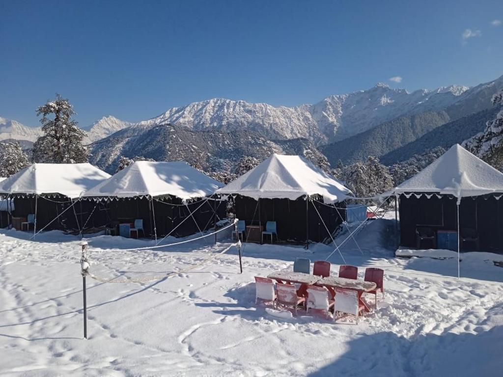 a group of tents in the snow on a mountain at grand holiday camp in Sari
