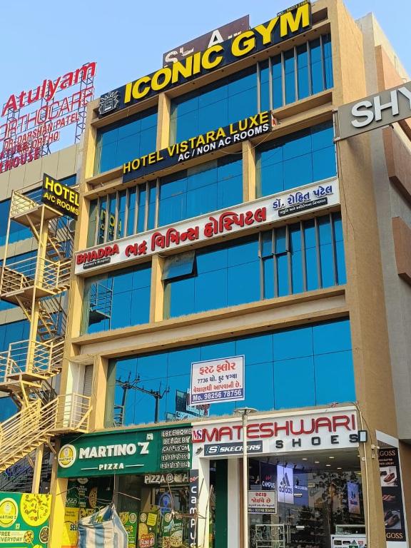 a building with many signs on the side of it at hotel vistara luxe in Himatnagar