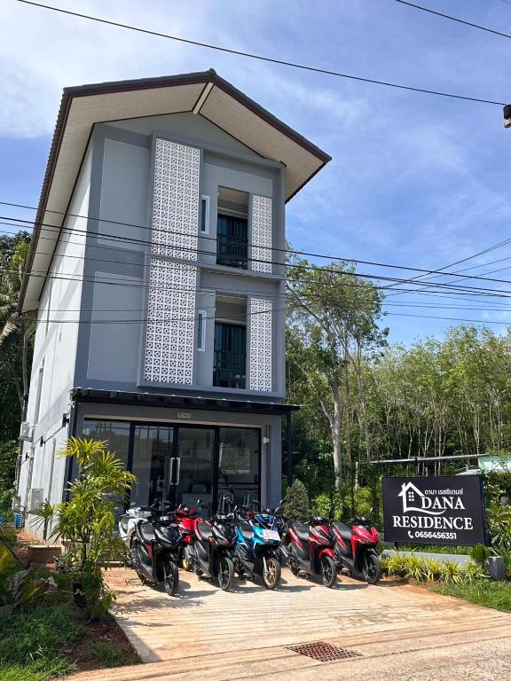 a group of motorcycles parked in front of a building at Dana Residence in Ko Yao Noi