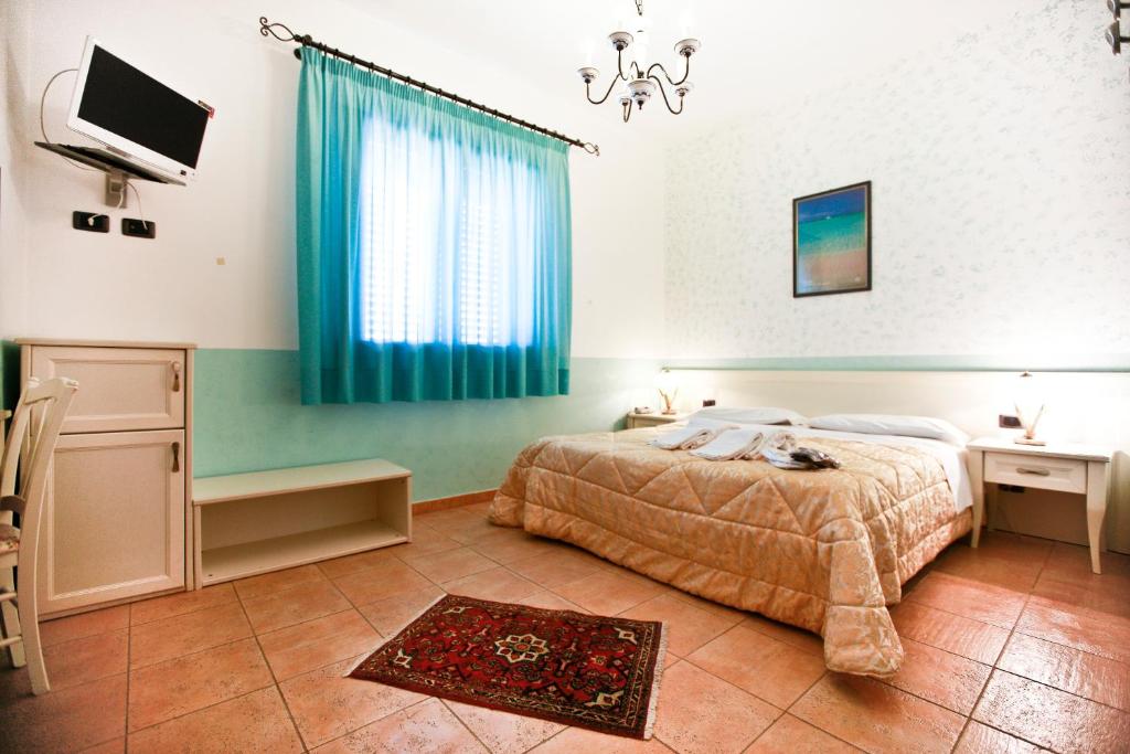Postel nebo postele na pokoji v ubytování History Hotel