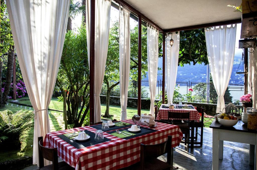 a table with a red and white checkered table cloth at Villa Albonico in Laglio