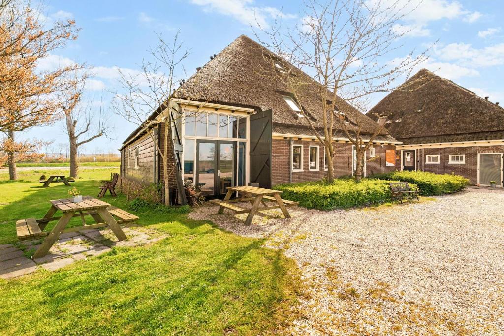 a house with a picnic table in front of it at Traphoeve in Schagen