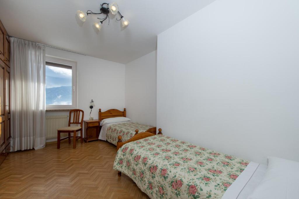 Łóżko lub łóżka w pokoju w obiekcie Residence Villa Boschetto