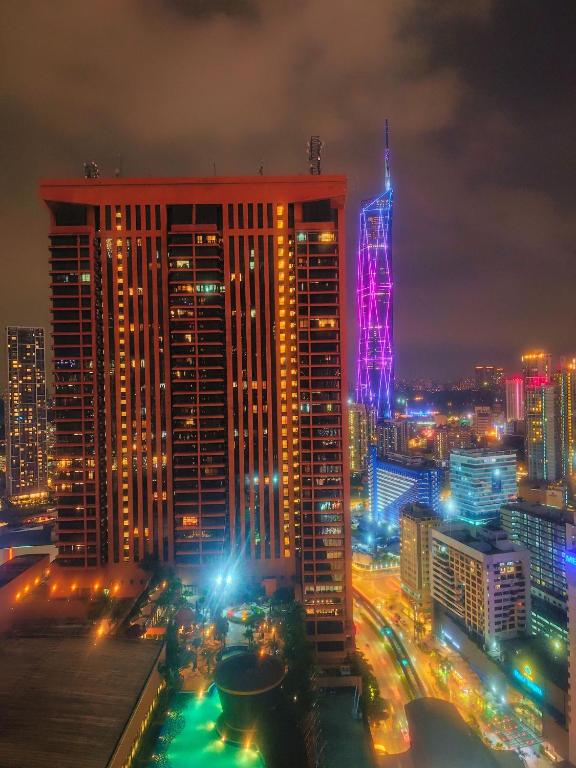 a view of a city at night with lights at Concord service suite time square in Kuala Lumpur