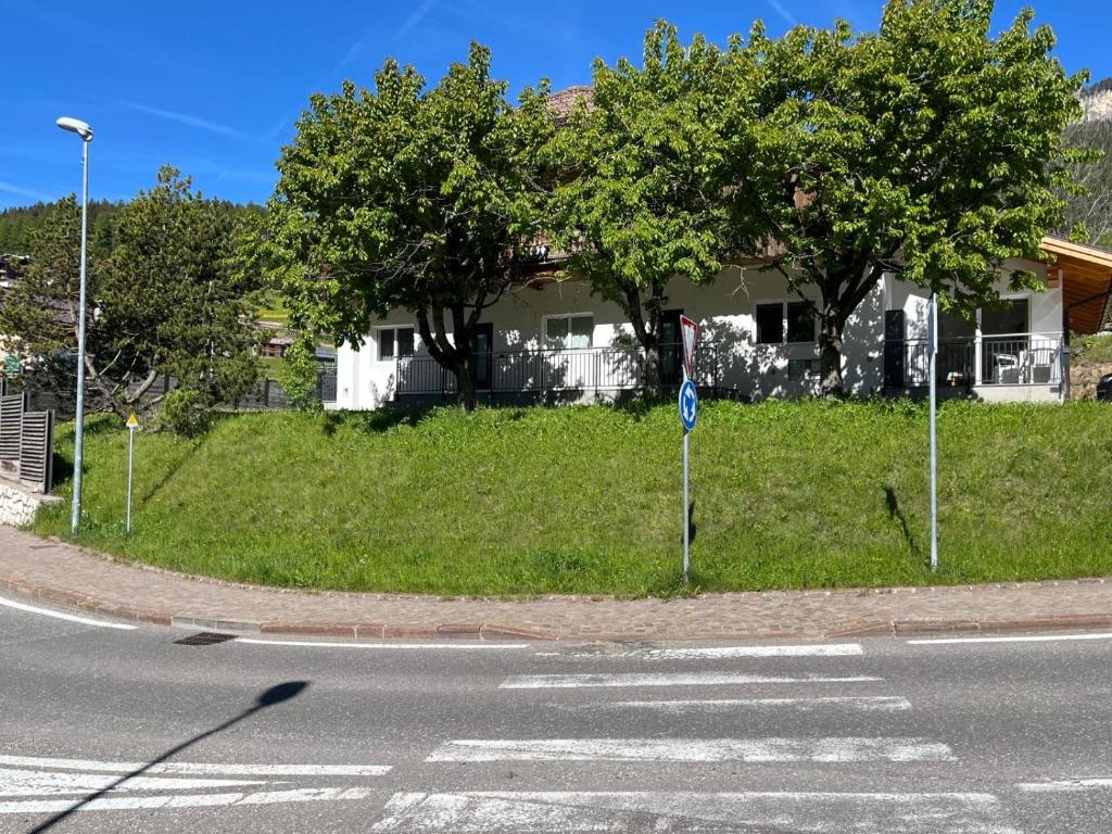 a crosswalk on a street in front of a house at Casa Vian in Vigo di Fassa