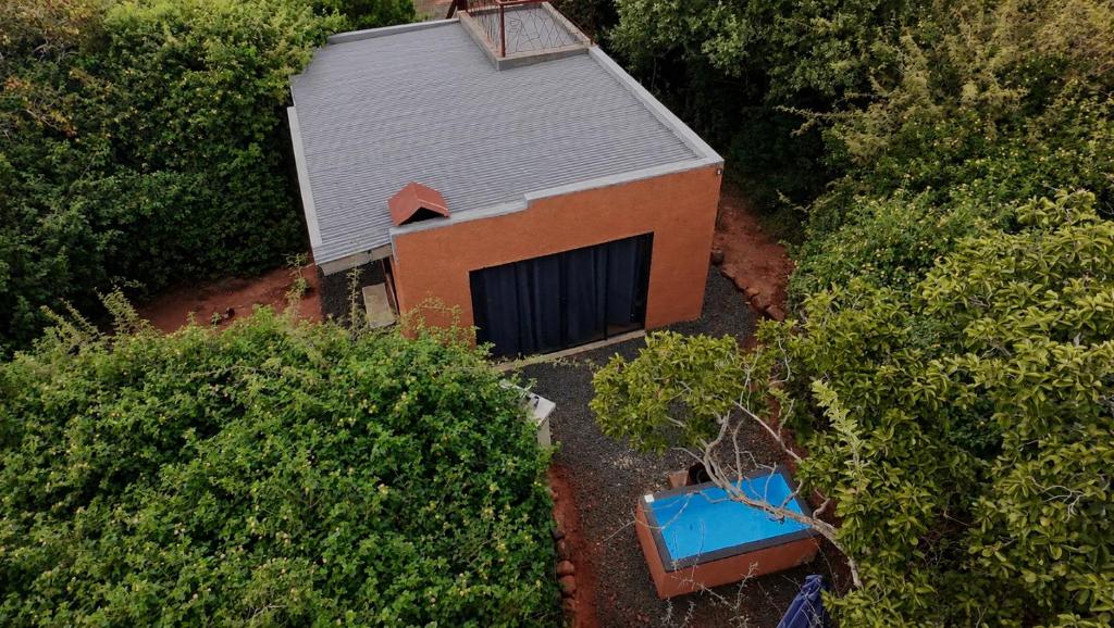an overhead view of a small building with a garage at Hartbeest Bush Stay #26 in Kosmos