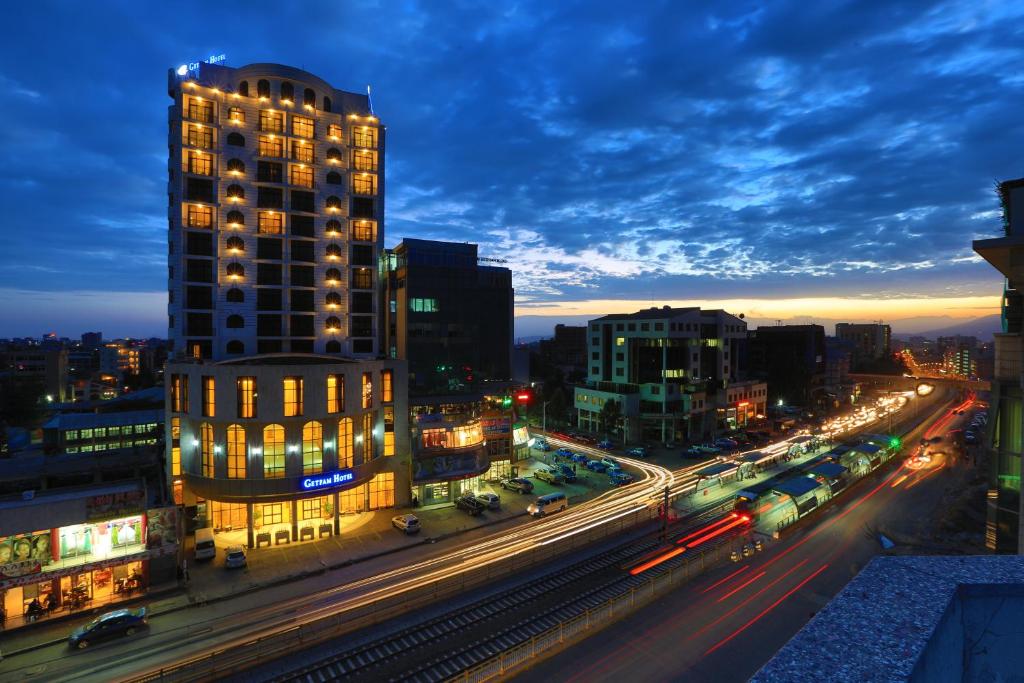 a city at night with traffic on a highway at Getfam Hotel in Addis Ababa