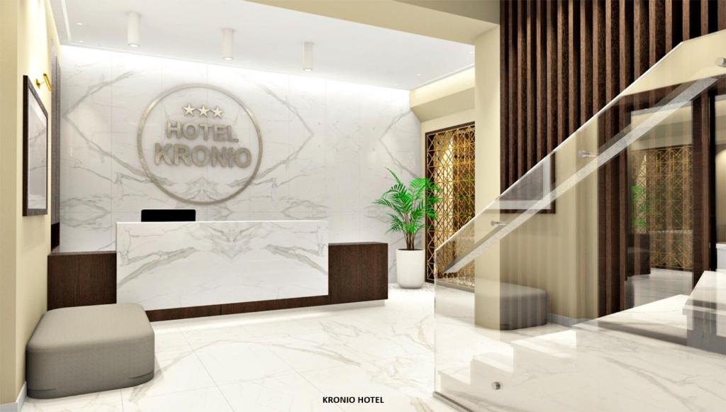 Die Lobby eines Hotels in Morongo mit einer Treppe in der Unterkunft Hotel Kronio in Olympia