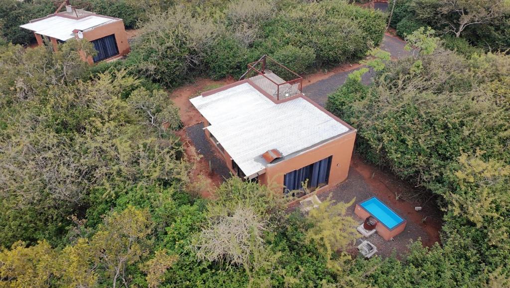 an overhead view of a house in the woods at Hartbeest Bush Stay #6 in Hartbeespoort