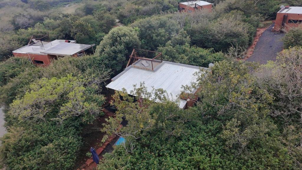 an overhead view of a house in the trees at Hartbeest Bush Stay #5 in Hartbeespoort