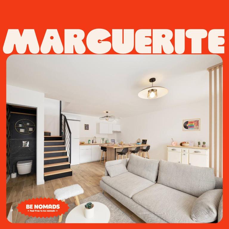 a magazine cover of a living room with a couch at Marguerite in Bédée