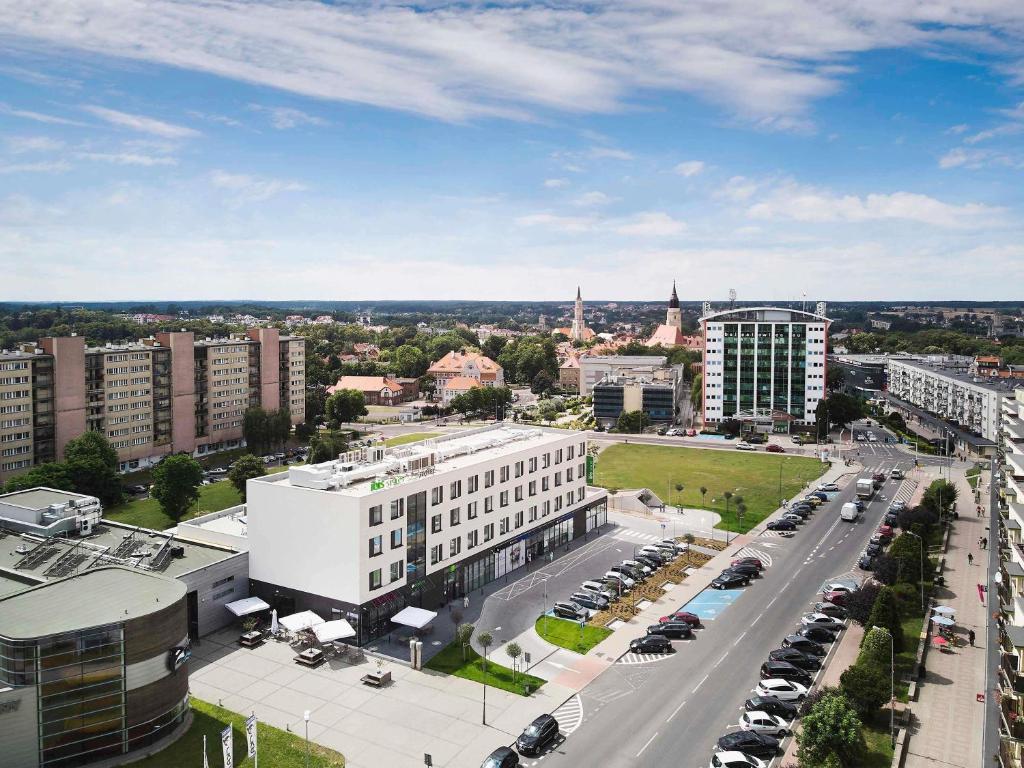 an aerial view of a city with a parking lot at ibis styles Bolesławiec in Bolesławiec