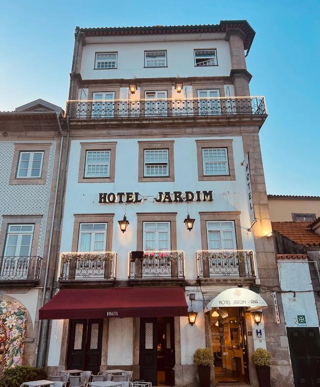 a hotel jardinian building with a sign on it at Hotel Jardim Viana do Castelo in Viana do Castelo