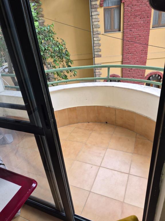 a view of a balcony from a window at Holiday Apartment 70meters from the sea in (( Stan i Ri ))