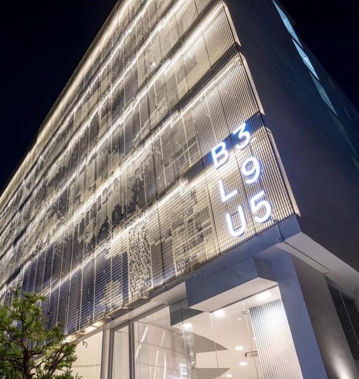a building with a sign on the side of it at BLU 395 Ari-Saphan Khwai in Bangkok
