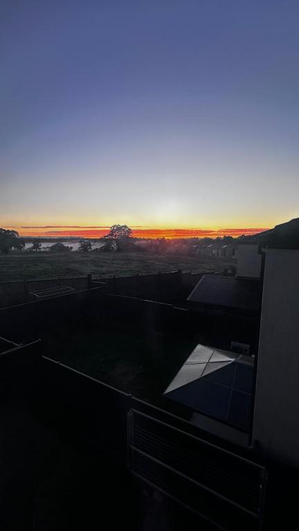 a view of the sunset from the roof of a building at Shared House in Melbourne in Bundoora